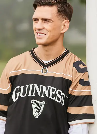 Guinness Official Merchandise American Football Jersey in Gold and Black 